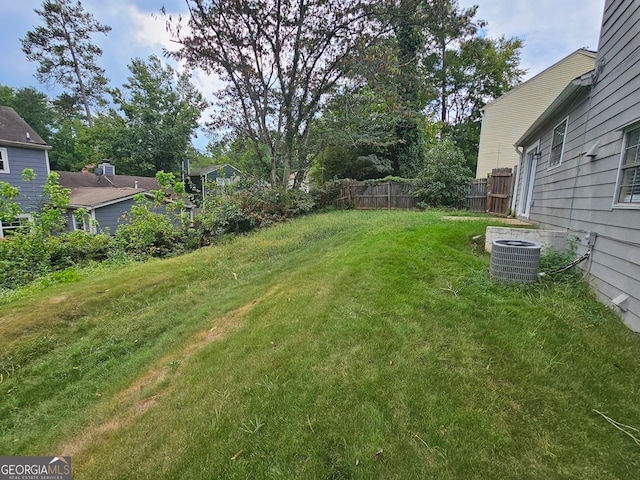 view of yard featuring central AC