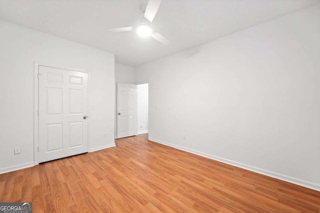 unfurnished bedroom featuring light hardwood / wood-style flooring and ceiling fan