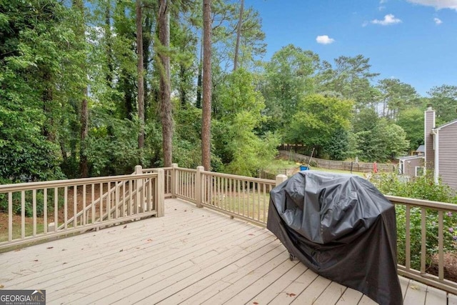 deck featuring a grill