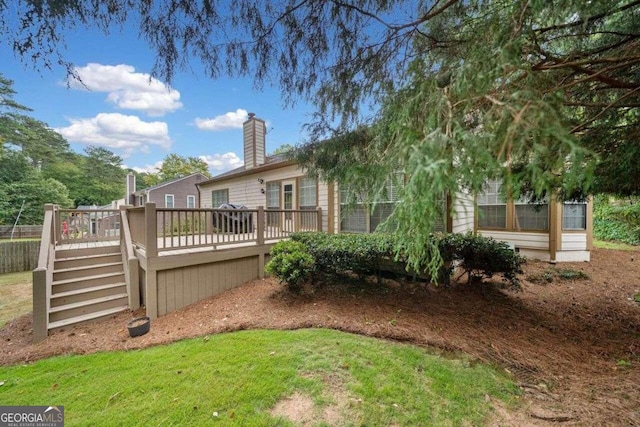 exterior space featuring a wooden deck