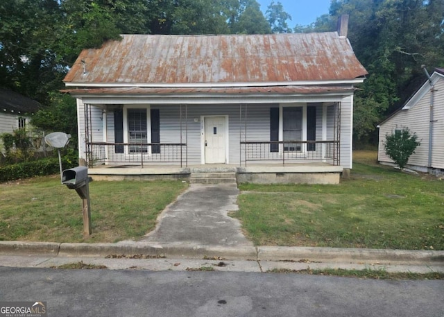 view of front of house with a front yard and a porch