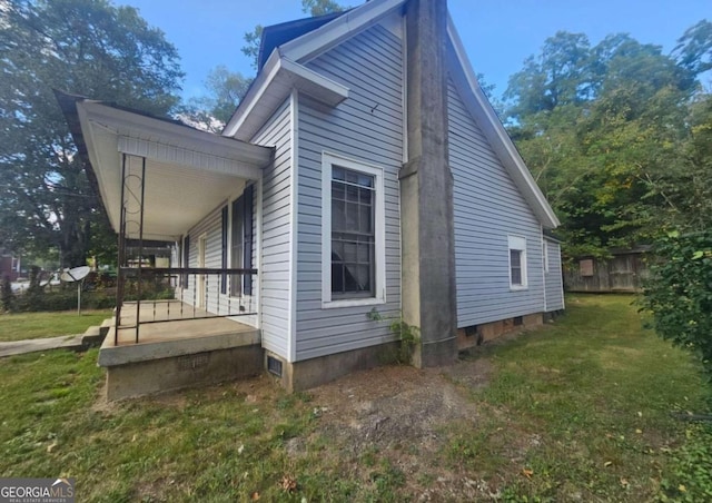 view of property exterior with a yard