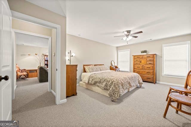 bedroom featuring ceiling fan and light colored carpet