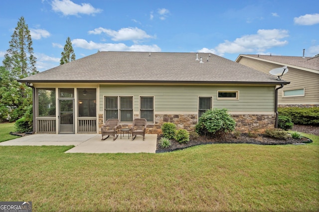 back of house with a sunroom, a yard, and a patio