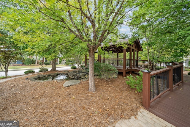 view of yard with a deck