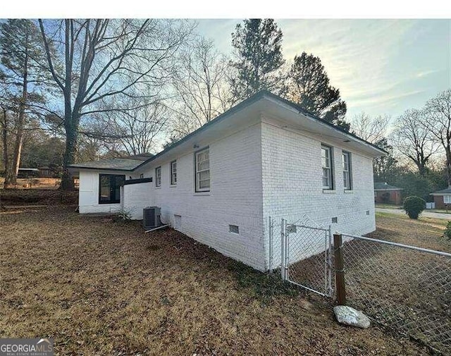 view of home's exterior with central AC