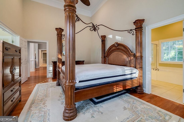 bedroom featuring hardwood / wood-style floors, ceiling fan, and ornamental molding