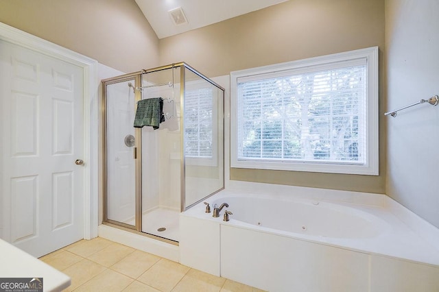 bathroom with tile patterned flooring, a healthy amount of sunlight, and separate shower and tub