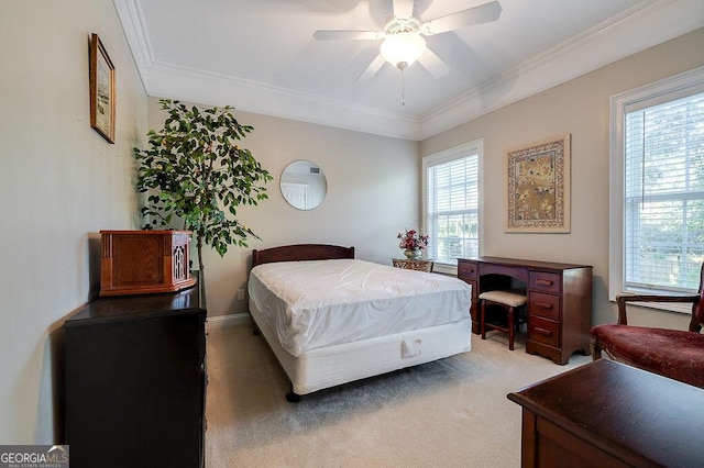 bedroom with carpet flooring, ceiling fan, and crown molding