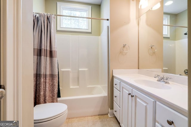 full bathroom featuring vanity, shower / bath combo, and toilet