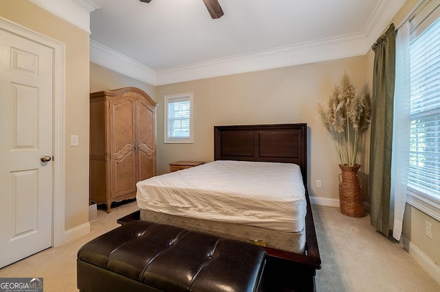 bedroom featuring multiple windows, ceiling fan, light colored carpet, and ornamental molding