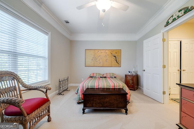 carpeted bedroom featuring ceiling fan and ornamental molding