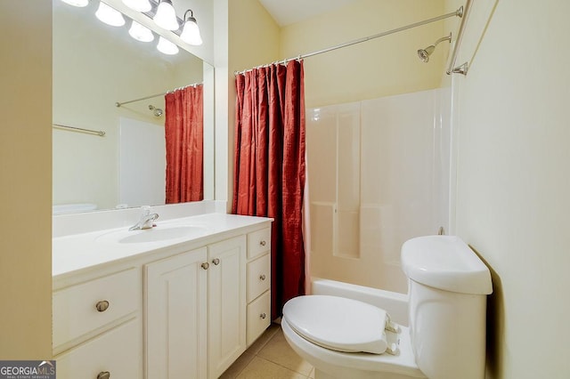 full bathroom featuring tile patterned floors, vanity, toilet, and shower / bath combo with shower curtain