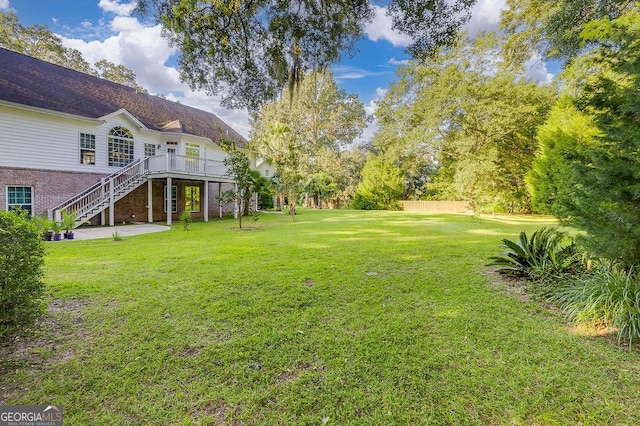 view of yard featuring a deck