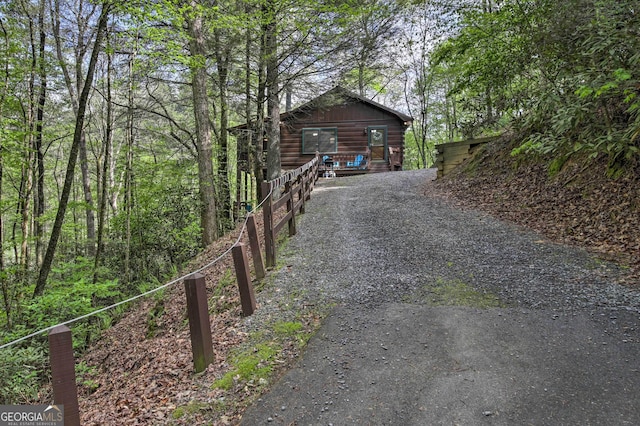 view of road featuring gravel driveway