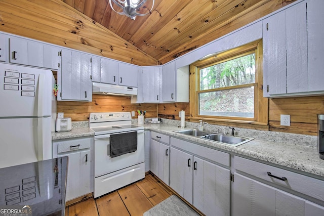 kitchen featuring lofted ceiling, wooden ceiling, a sink, white appliances, and under cabinet range hood