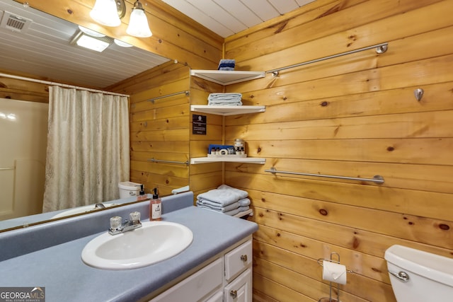 full bathroom with curtained shower, visible vents, toilet, wooden walls, and vanity