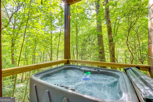 488 Joann Sisson Rd, Blue Ridge, GA 30513 - wooden terrace featuring a hot tub and a wooded view