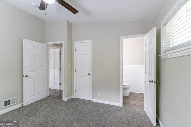 1278 Lynwyn Ln SE, Atlanta, GA 30316 - unfurnished bedroom featuring visible vents, carpet floors, lofted ceiling, and ensuite bath