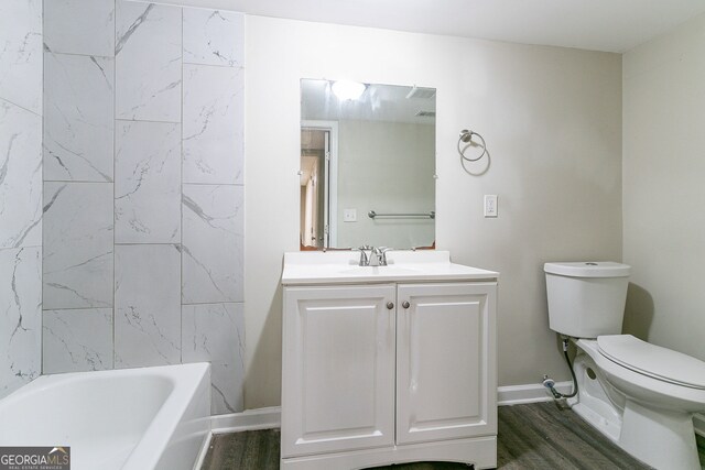 1278 Lynwyn Ln SE, Atlanta, GA 30316 - full bathroom with vanity, toilet, wood finished floors, and baseboards