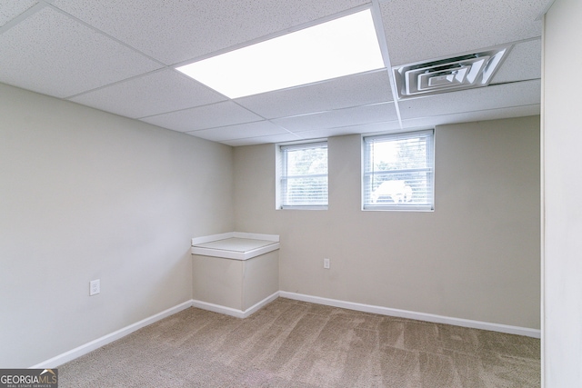 1278 Lynwyn Ln SE, Atlanta, GA 30316 - basement featuring light carpet, a paneled ceiling, and baseboards