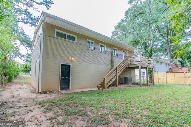 1278 Lynwyn Ln SE, Atlanta, GA 30316 - rear view of property featuring a deck, fence, a yard, cooling unit, and stairs