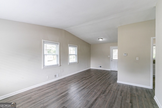 1278 Lynwyn Ln SE, Atlanta, GA 30316 - spare room with dark wood-style floors, visible vents, baseboards, and vaulted ceiling