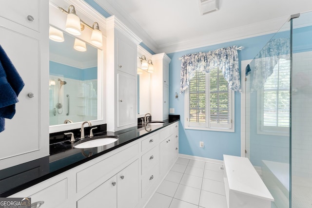 bathroom with ornamental molding, tile patterned flooring, an enclosed shower, and vanity