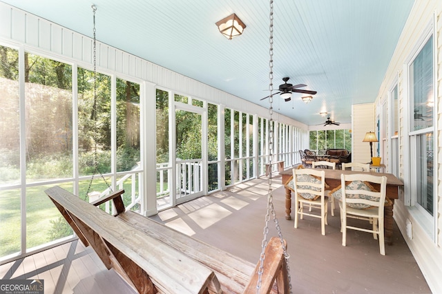 sunroom / solarium with ceiling fan