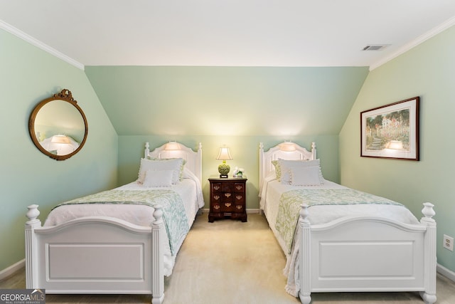 carpeted bedroom featuring ornamental molding and vaulted ceiling