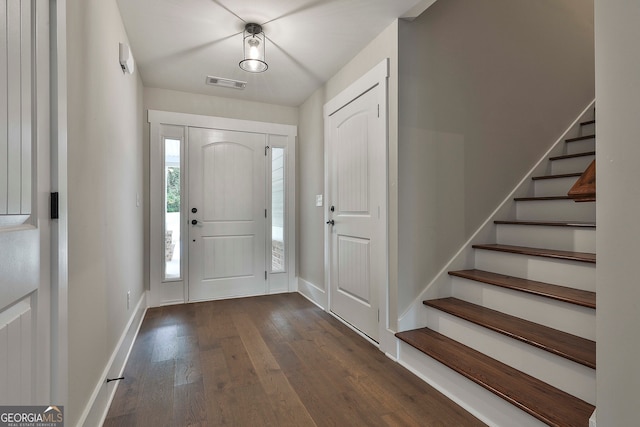 entrance foyer with dark hardwood / wood-style floors