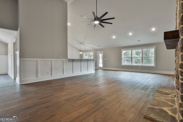 unfurnished living room featuring ceiling fan, high vaulted ceiling, and dark hardwood / wood-style flooring