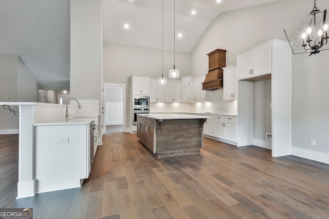 kitchen featuring stainless steel appliances, white cabinetry, high vaulted ceiling, sink, and dark wood-type flooring