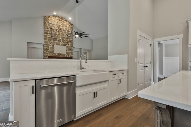 kitchen with white cabinetry, light stone countertops, stainless steel dishwasher, dark wood-type flooring, and pendant lighting