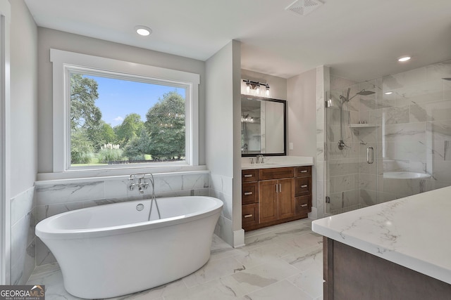 bathroom with vanity, plus walk in shower, and tile walls