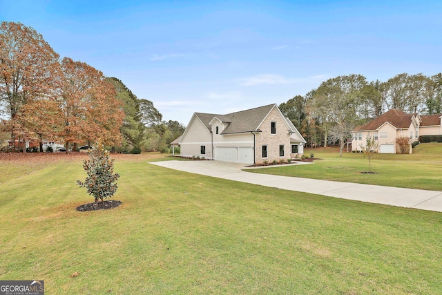 view of front of home with a garage and a front lawn