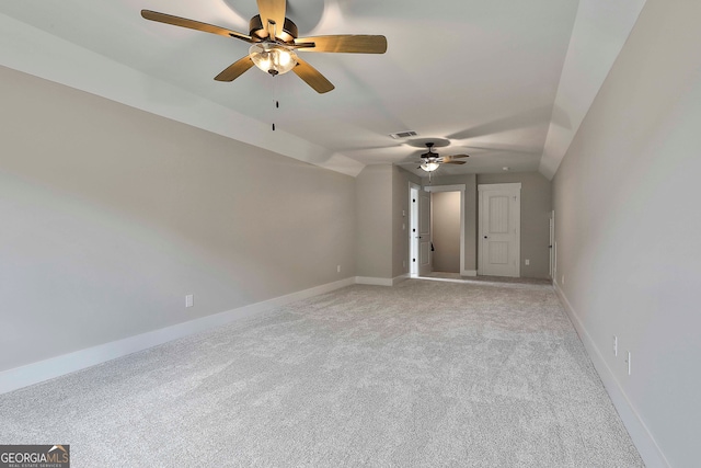 carpeted empty room with lofted ceiling and ceiling fan