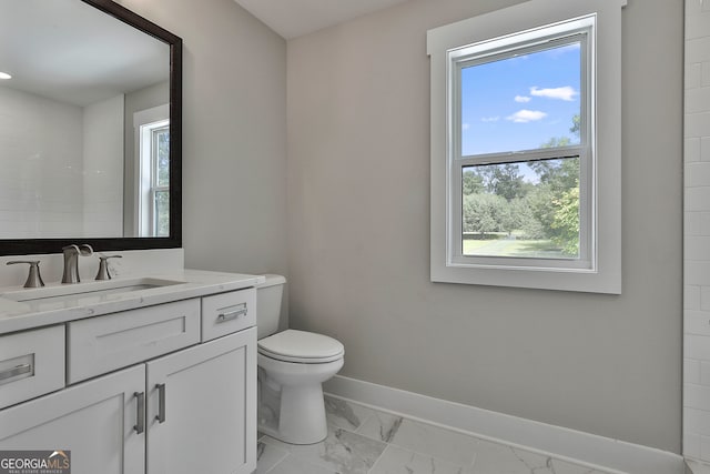 bathroom with vanity and toilet