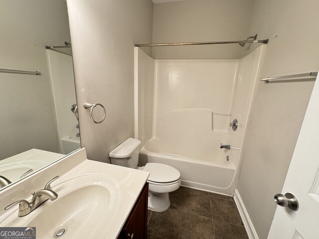 full bathroom featuring vanity, bathing tub / shower combination, toilet, and tile patterned flooring