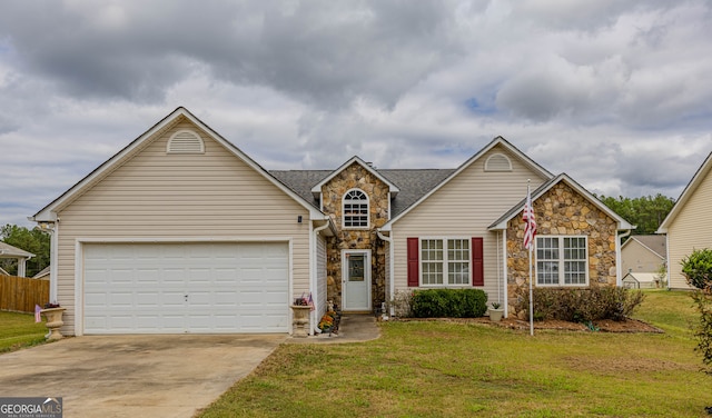 view of front of house featuring a front yard and a garage