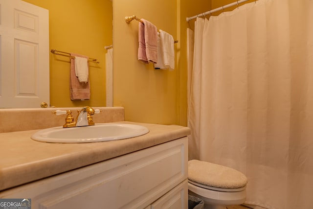 bathroom with vanity and toilet