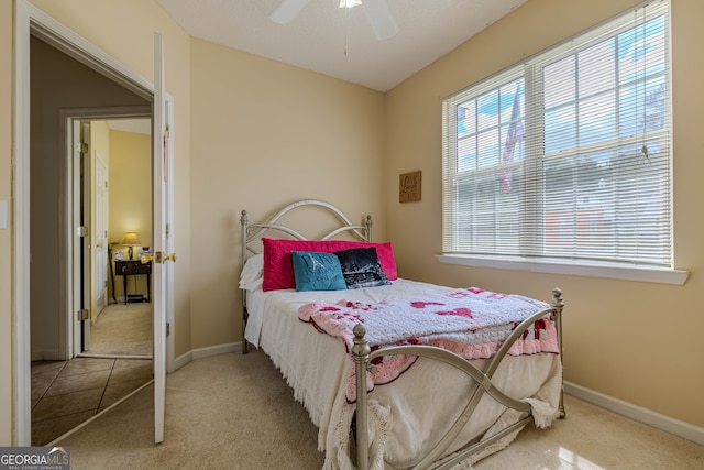 carpeted bedroom with ceiling fan