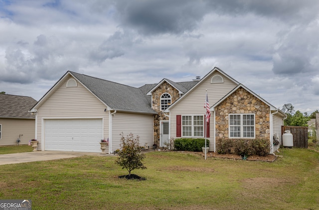 view of front of property featuring a front yard and a garage