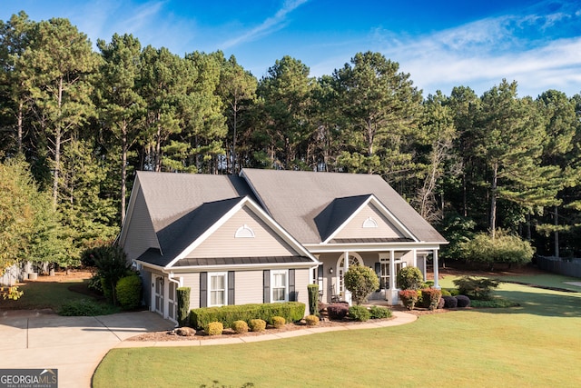 view of front of house with a garage and a front lawn