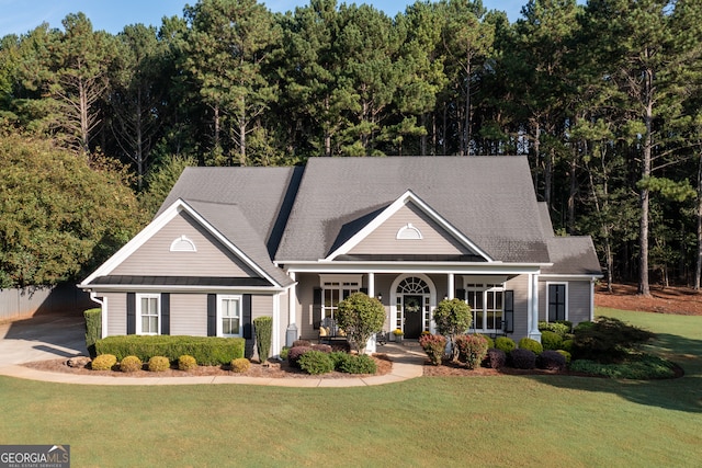 view of front of property with a porch and a front lawn