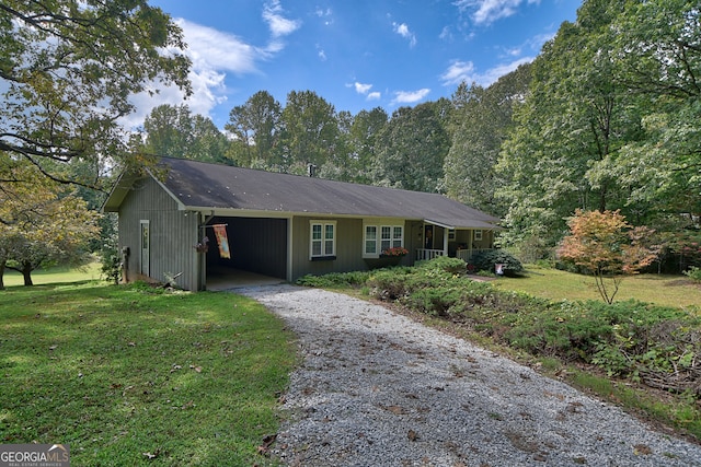 ranch-style home featuring a front yard and a carport