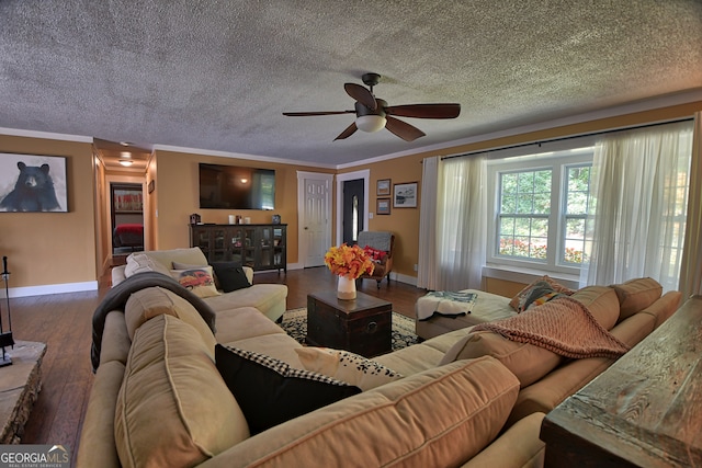 living room with a textured ceiling, wood-type flooring, crown molding, and ceiling fan