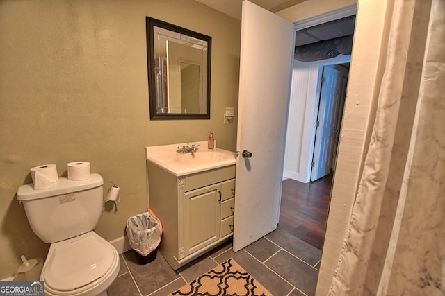 bathroom featuring hardwood / wood-style floors, vanity, and toilet