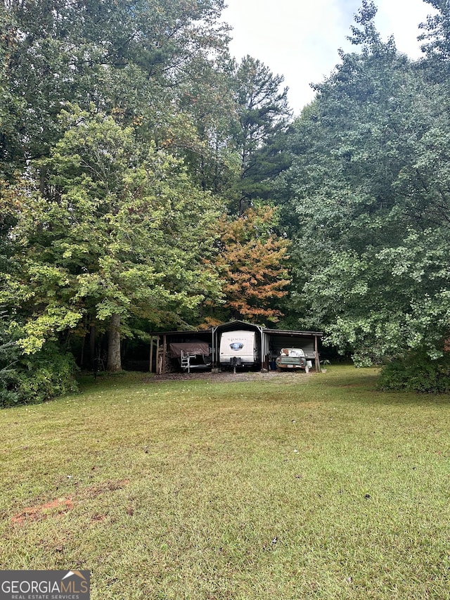 view of yard featuring a carport