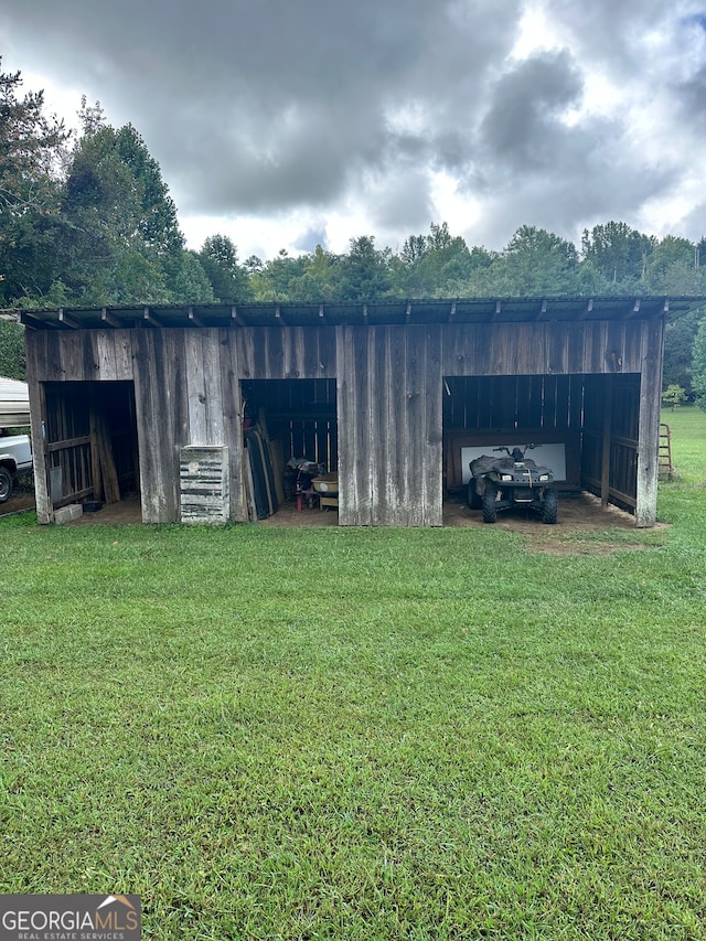 view of outdoor structure with a lawn